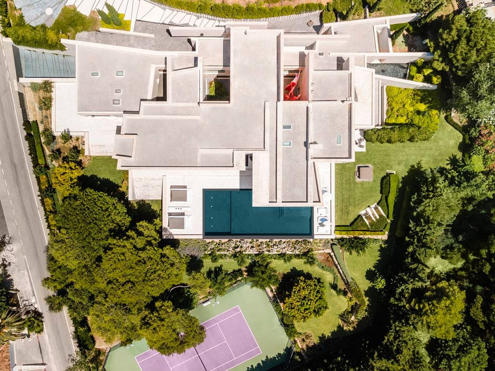 Aerial view of the private estate, pool, tennis court, and gardens