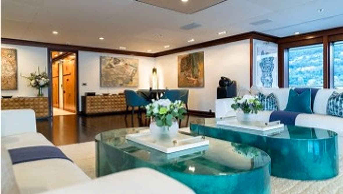 Luxury yacht interior salon with polished finishes and lounge seating